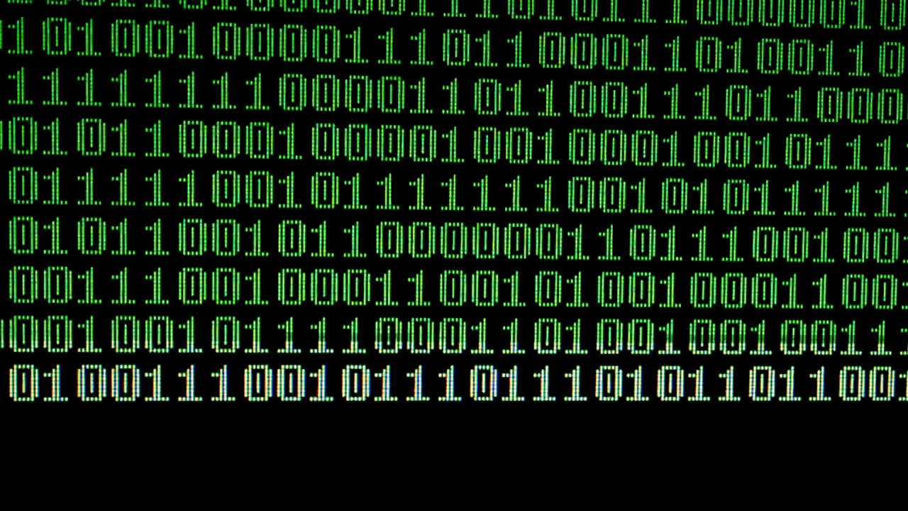 Binary code on the monitor screen. Shooting of a binary code, background