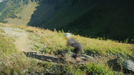 a cyclist rides a high alpine train in autumn