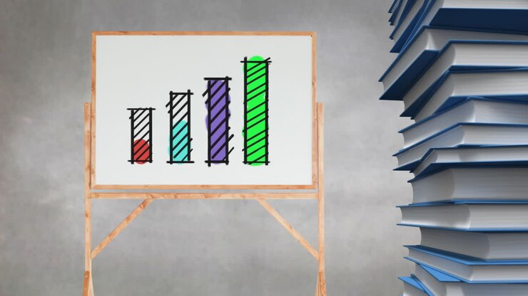 Bar graph drawing on blank canvas beside stack of books