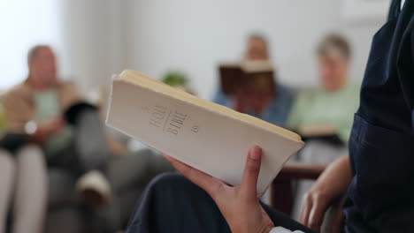 closeup, home and group with a bible