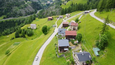 scenic italian mountain village rucavà, alpine houses and winding hillside roads