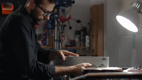 luthier working on guitar