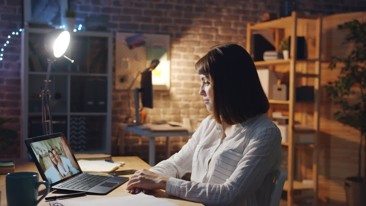 Woman in video call late at night