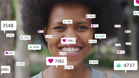 Animation-of-social-media-data-processing-over-smiling-african-american-woman-in-city