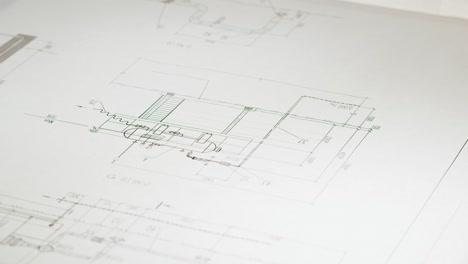 architect erasing details on a blueprint