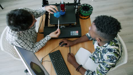 two men collaborating on a 3d printing project