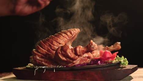 Close-Up-Of-Roasted-Chicken-Bbq-With-Salt-Sprinkle-Black-Background