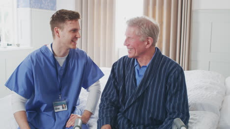 male doctor making home visit to senior man for medical check