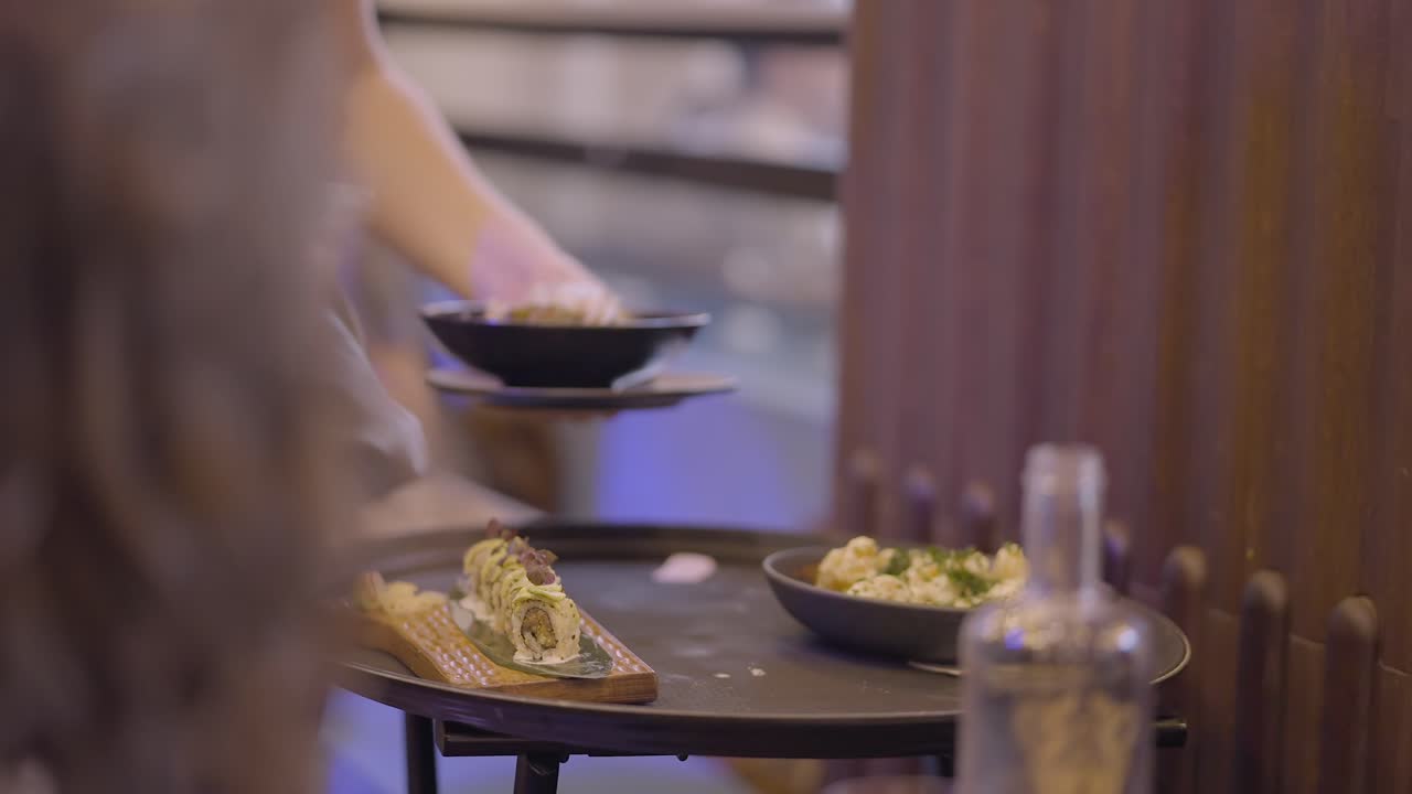 Serving sushi and other dishes in a restaurant