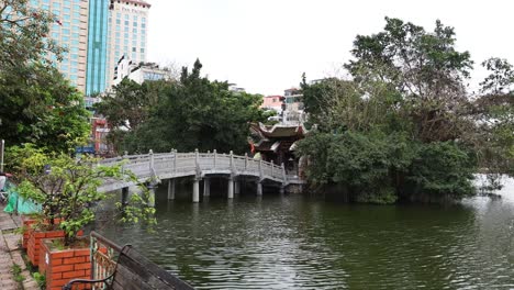 bridge and trees over a serene lake