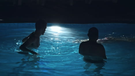 swimming pool at a luxury, tropical resort at night
