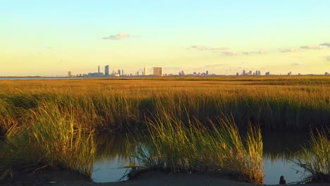HD-120-fps-static-waterway-view-of-Atlantic-City-skyline-with-mostly-clear-sky-near-golden-hour