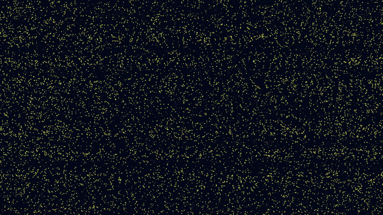 Flying small yellow glitters and dust on dark space