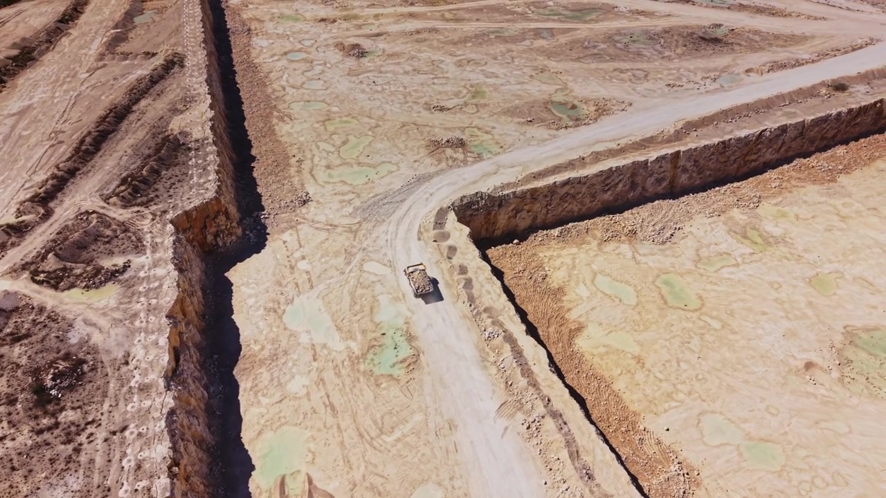 Construction site with a large vehicle surrounded by earthworks