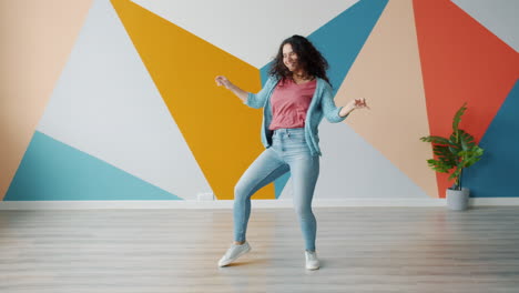 woman dancing in a colorful room