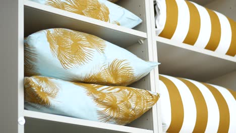 shelves filled with pillows and bedding