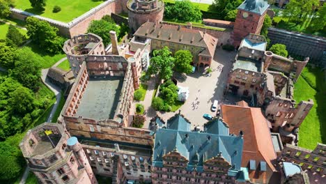 4k aerial drone video of the historic castle on königstuhl hill overlooking heidelberg, germany