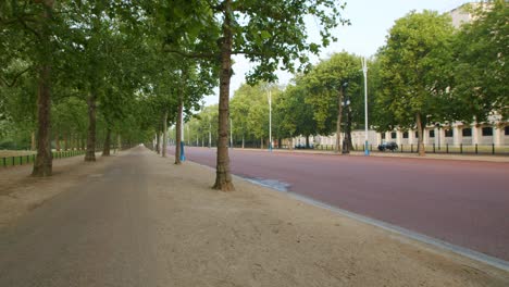 lockdown in london, slow motion gimbal walk along empty st james park and the mall, during the covid-19 pandemic 2020 on a sunny day