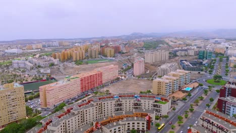 Aerial view of Las Palmas cityscape under hazy calima skies