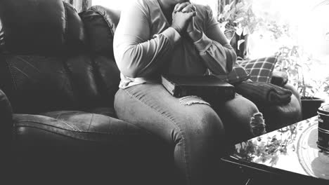 Black-and-White-of-young-black-woman-with-bible-praying-to-God-for-help