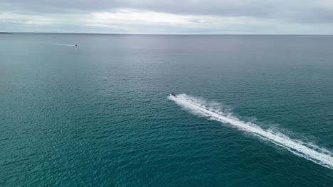 jet ski flying across the water as drone chases behind