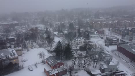 aerial view of the city of oxford, québec, canada, during a period of heavy snowfall. the image captures the blanket of white covering the residential areas, trees, and urban landscape in this winter.