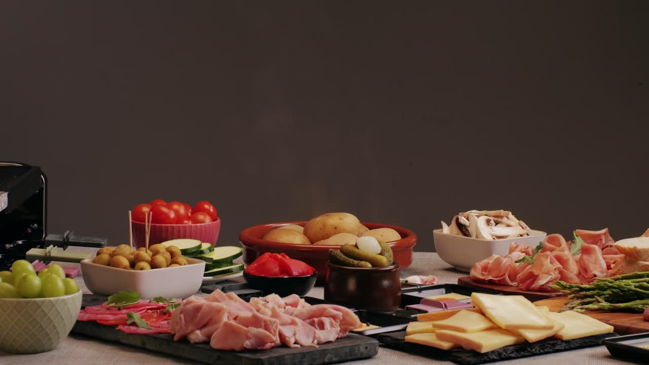 Italian or Spanish restaurant with traditional tapas food, Spanish cuisine, delicious tapas and cheese plate, bruschetta with cheese, olives dry tomatoes and tasty sandwich bar appetizer, buffet