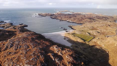 drone shot of the iron age house at bosta beach on the outer hebrides of scotland