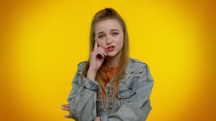 Doubting pensive girl pondering and imagining in mind, wondering difficult solution feeling confused