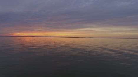 one yacht far in the curonian lagoon at sunset-1