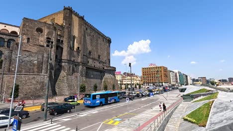 busy street scene with buses and pedestrians