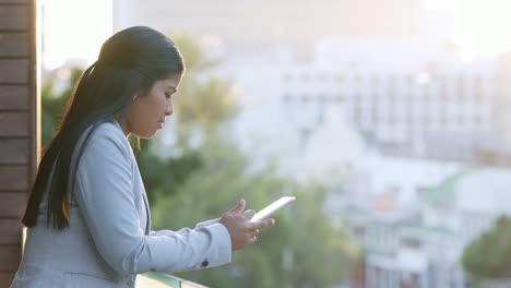 businesswoman using digital tablet to monitor