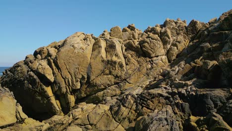 rocky coastline on a sunny day in furna de caion in a coruña, spain