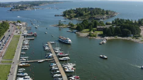 tourist yacht sailing between island and docks