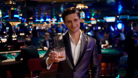 elegant man toasting with a drink in a casino