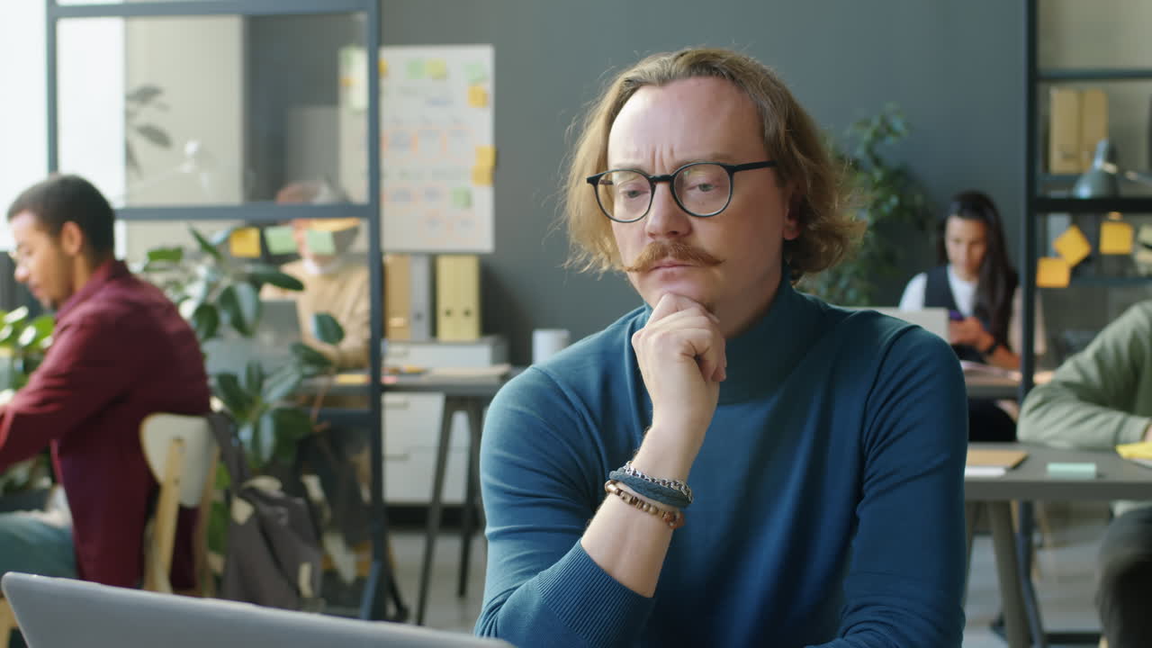 Timelapse of Thoughtful Office Worker at Desk