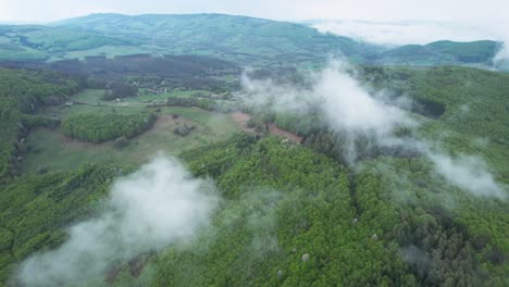 Beautiful-Low-Tatra-Mountains-Landscape-From-a-Bird's-Eye-View-Above-White-Low-Floating-Clouds-in-Banska-Bystrica,-Slovakia