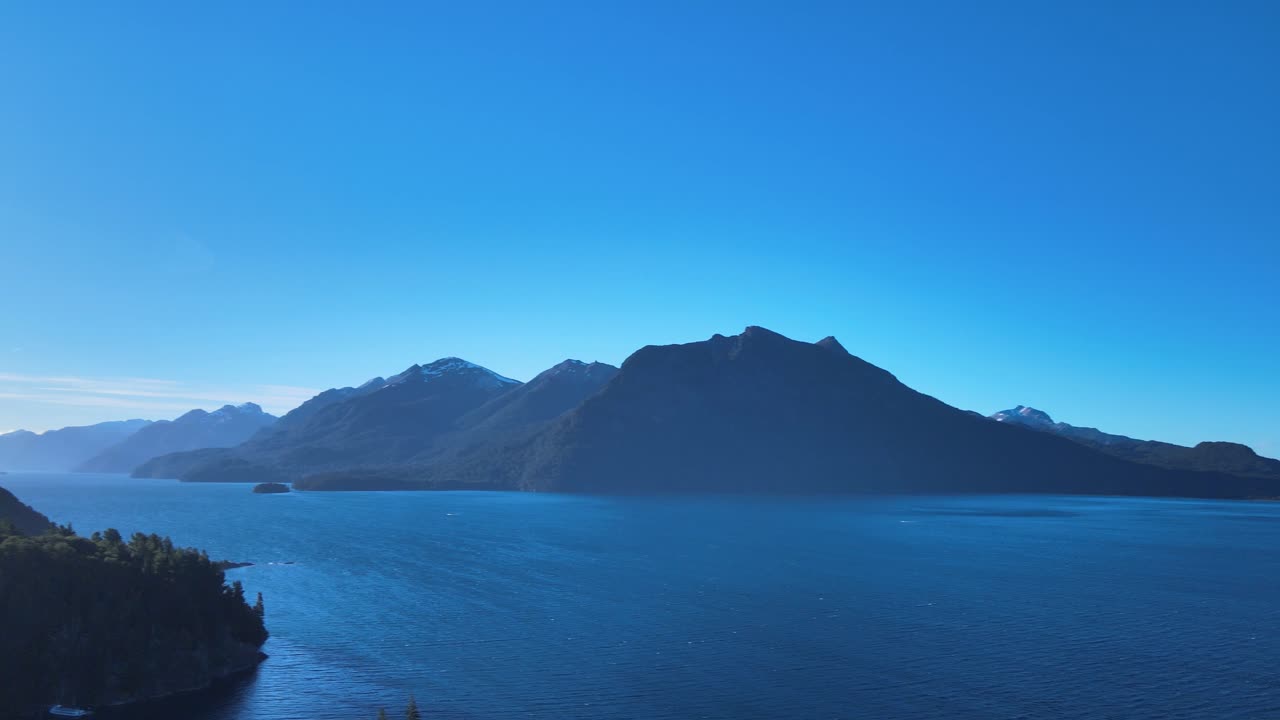 A turn of 180º pan shot at sunset on the lake of Villa Tacul, Patagonia Argentina. Aerial Footage
