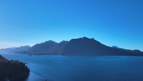 a turn of 180º pan shot at sunset on the lake of villa tacul, patagonia argentina. aerial footage