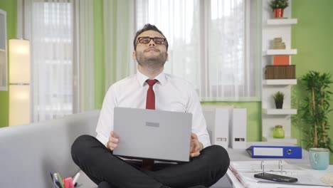 failed young businessman working on laptop.