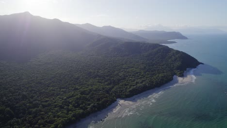 sunrise over green mountains of daintree national park, cape tribulation, qld australia