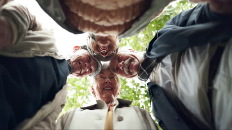 group of senior friends looking down at the camera