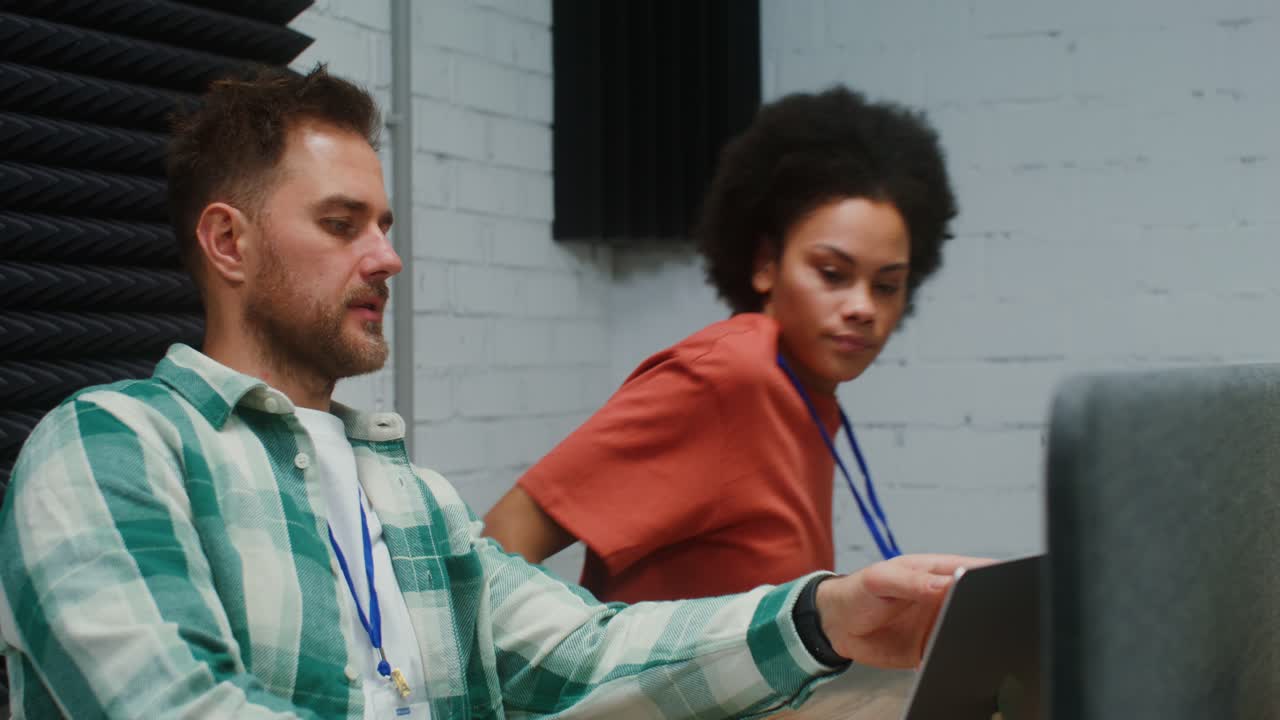 Businesspeople collaborating in a soundproof studio