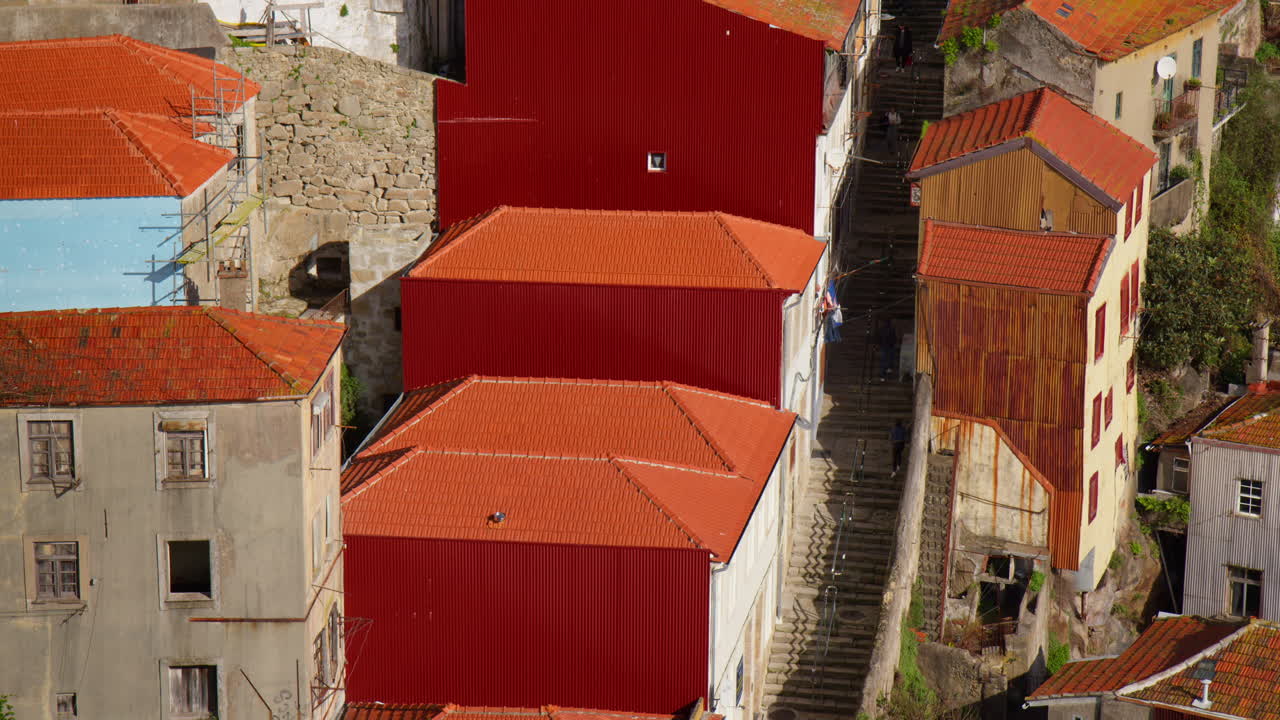 Red Tiled Roofs With Steep City Staircase Running Up From Douro River In Porto, Portugal. Aerial Shot