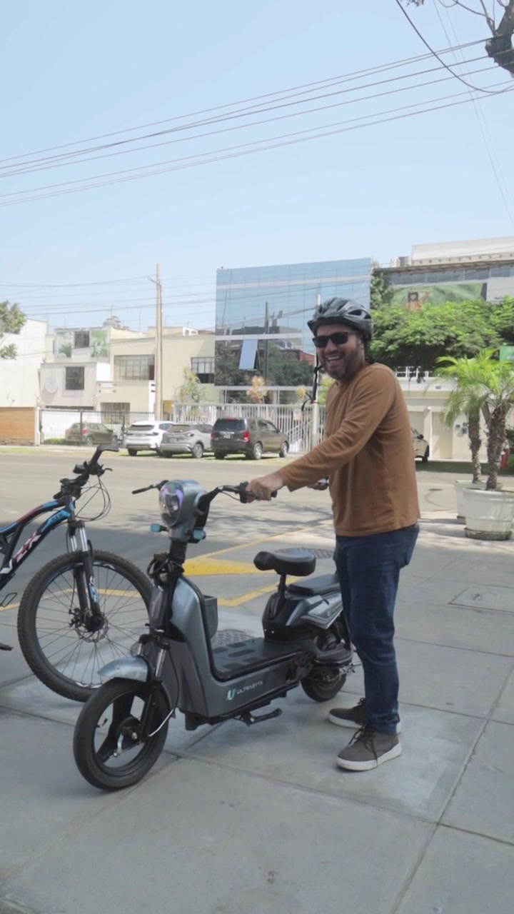 Happy Man with Electric Scooter and Bicycle on City Sidewalk