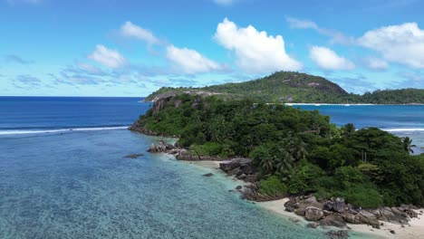 beautiful rainforest beach island of mahe in seychelles, drone shot