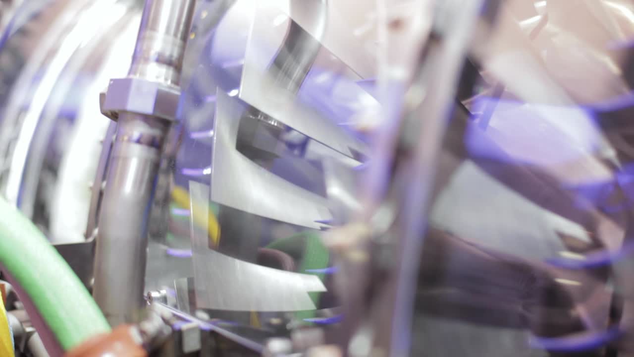 A close up of the spinning blades of a jet engine