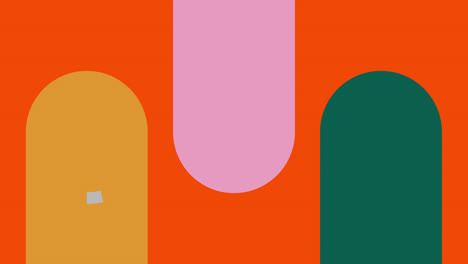 animación de cápsulas verdes, marrones y rosadas y anillos grises sobre fondo naranja