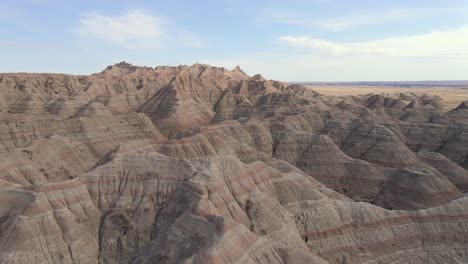 flying forward over desert hills mountains in badlands national park, south dakota, natural landscape