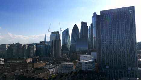 drone flying close to city of london commercial business skyscrapers